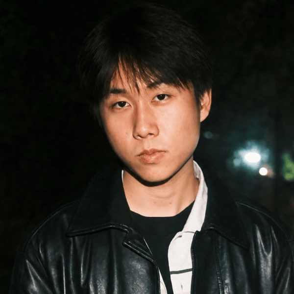 Jesse’s headshot shows him wearing a black leather jacket and a dark shirt.